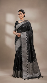 Beautiful lady wearing black saree with silver embroidery