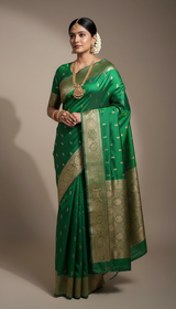 Beautiful lady wearing emerald green Banarasi silk saree with golden zari